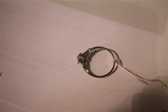 A white gold and single stone diamond ring, size M.